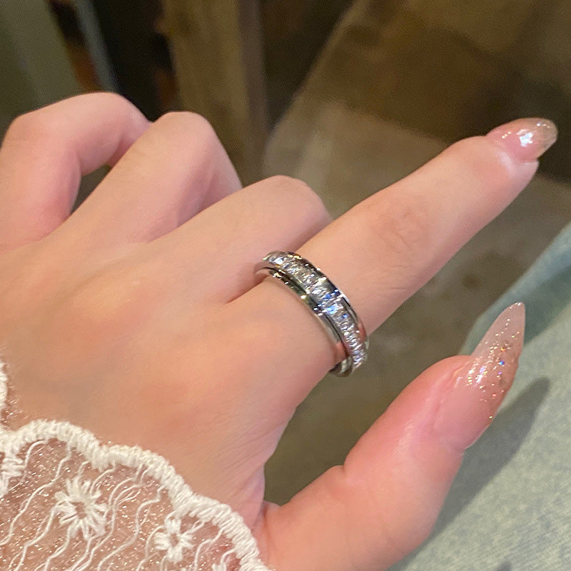 Anillo giratorio de titanio y acero con circonit