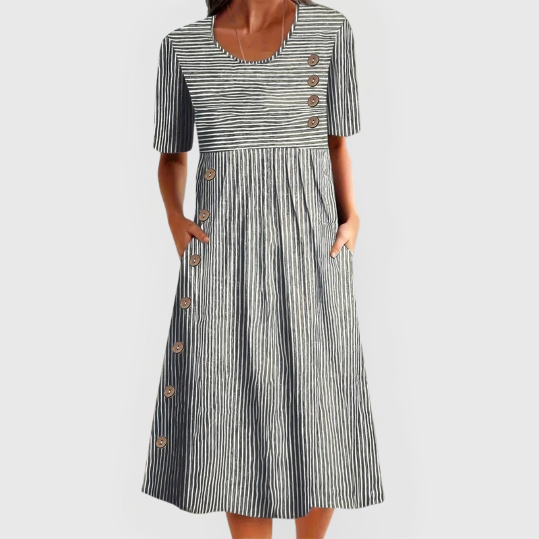 🎉🛍️¡Promoción imperdible! 50% de descuento en un vestido midi de rayas atemporal.
